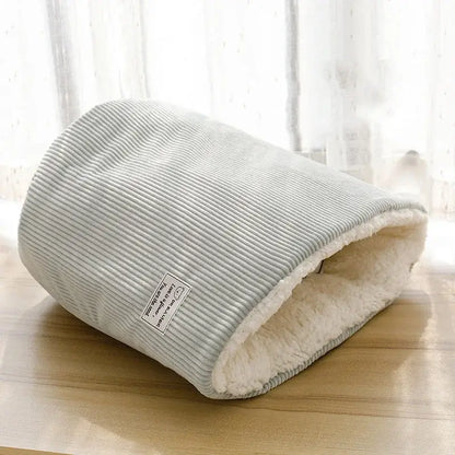 Cozy plush cat bed and dog sleeping cave in soft gray, perfect for small pets to stay warm during winter.