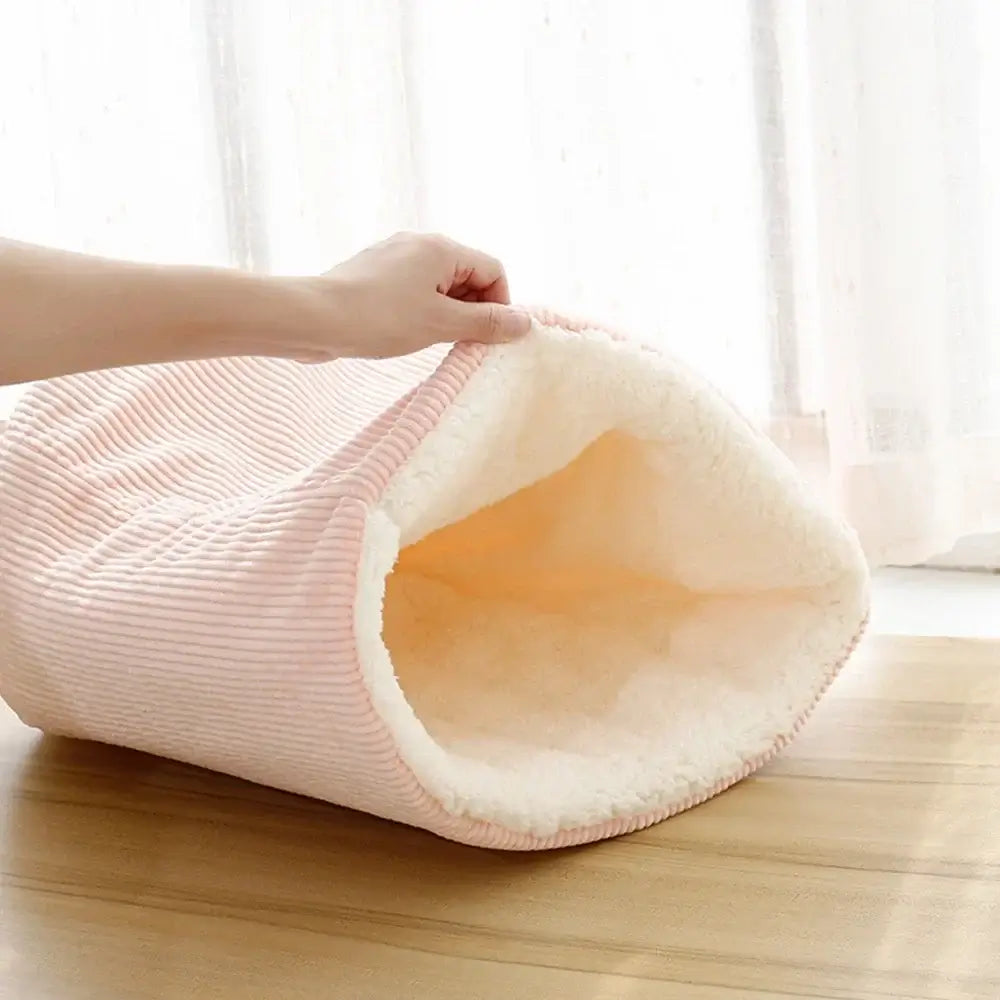 Soft plush cat bed and dog sleeping cave with cozy interior, perfect for small pets.